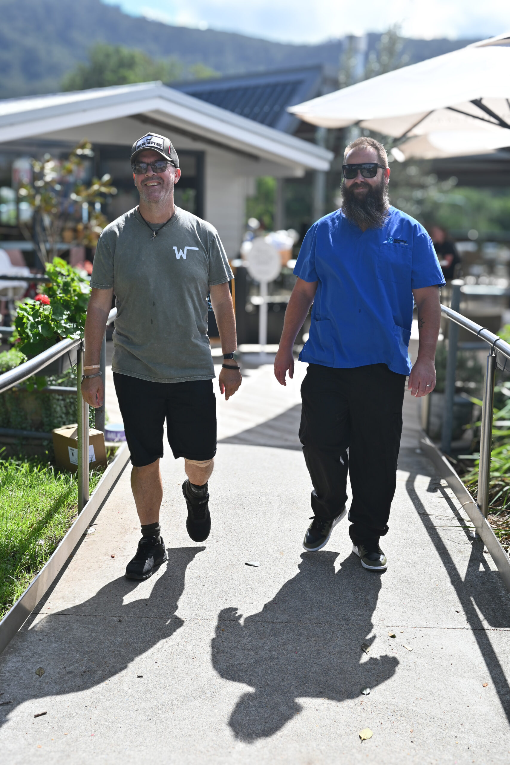 Essential Care worker with NDIS client on outing